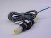 Omega Engineering FTB604 turbine flow meter shown with full cable coiled and barbed fittings with yellow end caps