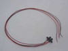 Single Honeywell HOA1881-013 optoswitch unit with full 21-inch red, black, and white pigtail leads laid out on white surface
