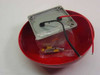 System Sensor SSV120-8 bell interior — underside view showing mounting plate, wiring, and plastic bag of mounting hardware including screws and fasteners