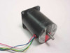 Oriental Motor Vexta PH268-21B NEMA23 stepper motor – three-quarter front view showing black cylindrical body, square mounting flange, label with specs, and multi-color flying leads with rear shaft visible