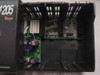 PLC Direct D2-03B DirectLogic 205 interior close-up — Koyo branding visible, two module PCBs installed (Z-02B A board visible), power supply board with capacitors and components
