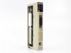 Sharp JW-20CM PLC Network Link Module – angled front-left view showing module housing and label