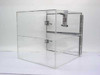 Dwyer acrylic desiccator with both doors open showing two-compartment interior, aluminum shelf divider, and toggle clamp latch hardware