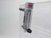 Dwyer RMA-6-SSV flow meter close-up mounted on desiccator side panel, labeled SCFH AIR with scale to 20, inlet fitting above and needle valve below