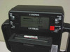 Polaroid Laminex LX400 top control panel showing LCD display reading READY, Laminex LX Series label, frame selector, shutter button, and loaded Polaroid film pack