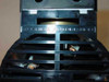 Tosei Engineering PSL-101A pump close-up top view of cylinder head showing 'Toshiba Automation' embossed lettering on black plastic housing