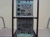 Amray 124-002 Dual Ion Pump Power Supply — rear view of both modules showing back panel venting and open rack frame