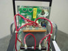 Amray 124-002 Ion Pump Power Supply — internal view of one module showing green PCB, red high-voltage wiring, and transformer assembly