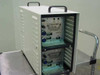 Amray 124-002 Dual Ion Pump Power Supply — front three-quarter view showing two stacked modules in white rack case with carry handles