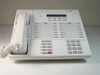 Lucent MLX-28D white office phone — front view showing handset, LCD display, 28 programmable buttons, and full keypad