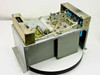 RCA MI-560772 Raw DC Power Supply — angled top view showing internal components including transformer assembly, blue capacitors, and PCB