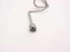 Close-up of SMA-M male connector end on stainless steel pre-formed coaxial cable showing center pin and hex body