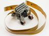 IBM 4208 XL24 Proprinter printhead — rear three-quarter view showing print pin assembly, carriage clips, and ribbon cables coiled around unit