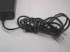 Murata EB-100U AC power cord close-up showing coiled black cable with standard two-prong US plug