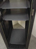 Winstead rackmount cabinet lower interior close-up showing 3 gray shelves, rack rails, and bottom caster base