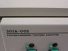 Data I/O 303A-002 close-up of front panel label reading '303A-002 PROGRAMMING/TESTING ADAPTER' with two ZIF socket tops visible