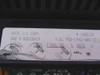 Data I/O 303A-002 underside label showing Data I/O Corp., P/N 950-1942-008 F2, SWO N5025A19, serial number 1403124, and QC inspection stamps