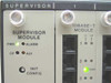 Close-up of 6203-00 Supervisor Module front panel showing PWR, ALARM, CP, AUI indicators and INIT CONFIG button; adjacent 6312-00 10Base-T Module showing RJ-45 ports and LI/LA LEDs with PWR indicator lit