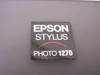 Epson Stylus Photo 1270 model badge close-up on top panel showing brand and model identification
