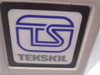 Close-up of Tekskil TS logo badge on teleprompter housing — blue and white brand emblem