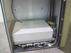 Amistar PlaceMaster FP — lower interior compartment showing electronics enclosure, pneumatic components, and control PCBs beneath tray stack