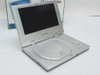 Initial IDM-830 portable DVD player open showing 8" TFT widescreen display and disc tray with control buttons