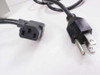 Power cable connectors closeup showing IEC C13 output connector (left) and NEMA 5-15P input plug (right)