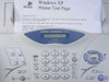 Brother IntelliFAX 2900 front panel close-up – laser plain paper fax label, full numeric keypad, Windows XP printer test page in feeder