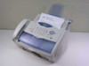 Brother IntelliFAX 2900 laser fax machine – front 3/4 view with handset, ADF, and paper tray, Windows XP printer test page loaded