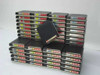 Large lot of 3M E Cart 3490E compatible tape cartridges stacked in rows with colorful spine labels