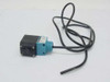 Micro Switch MPC6 MPW11 infrared light beam photo head — front-left view showing teal housing, threaded lens nose, and attached cable leads