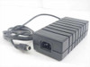 Toshiba 280009-A0 AC power supply – front/side view showing IEC C14 AC inlet, ribbed black housing, and Mini-DIN DC output cable