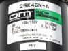 Oriental Motor 2SK4GN-A motor nameplate label showing model number, 4W, 100/110V, 50/60Hz, 0.25A, 1500/1800 RPM, and 1.5/1.2µF capacitor rating