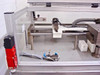 Pneumatic linear motion table interior – showing shuttle carriage, pneumatic cylinders, guide rails, and tooling fixture on aluminum frame