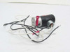 Humphrey 062-4E2-CD solenoid valve — reverse 3/4 view showing opposite side of silver valve body, port, and pink flag label on coil with three wires