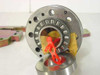 INA ZARF 2575 LTN axial needle roller bearing close-up showing cylindrical roller cage with visible rollers, red retainer clip, and lower thrust washer