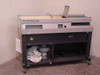 Horizon BQ-140 Perfect Binder – full front-left view showing operator table, clamp assembly, and undercarriage with blower motor on castors