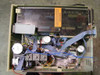 Waters 712 WISP – internal top-down view with cover removed showing motor drive assemblies, wiring harness, PCBs, and electrical components; Electrical Shock Hazard warning label visible