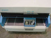 Hybritech Photon ERA-QA Analyzer – front access door open revealing sample tray bays and reagent bottle compartment with two bottles visible