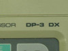 Close-up of Mitutoyo DP-3DX model designation label on front panel reading 'DIGIMATIC MINI-PROCESSOR DP-3 DX'