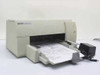 HP C2163A DeskWriter 540 Mac inkjet printer – front three-quarter view with paper tray extended and power adapter alongside