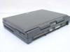 AST Ascentia 900N laptop closed — right-rear three-quarter view showing rear port area with VGA, parallel, serial, and PS/2 mouse connectors