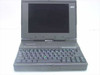AST Ascentia 900N laptop open — front view showing display, full keyboard, and trackball pointing device