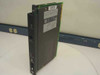 Allen-Bradley 1771-P4S 120V AC Power Supply Module — angled front-left view showing faceplate with status indicators and backplane connector edge