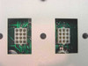 LogE 55-EM monitor — rear panel detail showing two 12-pin proprietary connector ports on green PCB