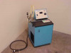 Accurate Gas Control Systems AG-T bath chiller heater – right front three-quarter view showing blue cabinet, top-deck control panel, flexible hoses, and power cord