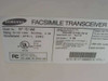 Samsung SF-5100 bottom label showing model number, AC 100–120V 50/60Hz 2.0A rating, April 2002 manufacture date, UL listing, FCC registration A3LKOR-27795-FA-E, and Made in Korea