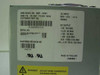 NMB MSP-145A1 power supply label showing AC input 100-127V and DC output specs — separate item photographed with the drive