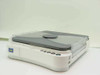 Canon PC150 personal copier – front 3/4 view showing fold-up lid closed, front control buttons, and transparent paper output tray