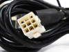 Close-up of 9-pin motor cable connector end showing yellowed housing with wear and soiling on the connector body